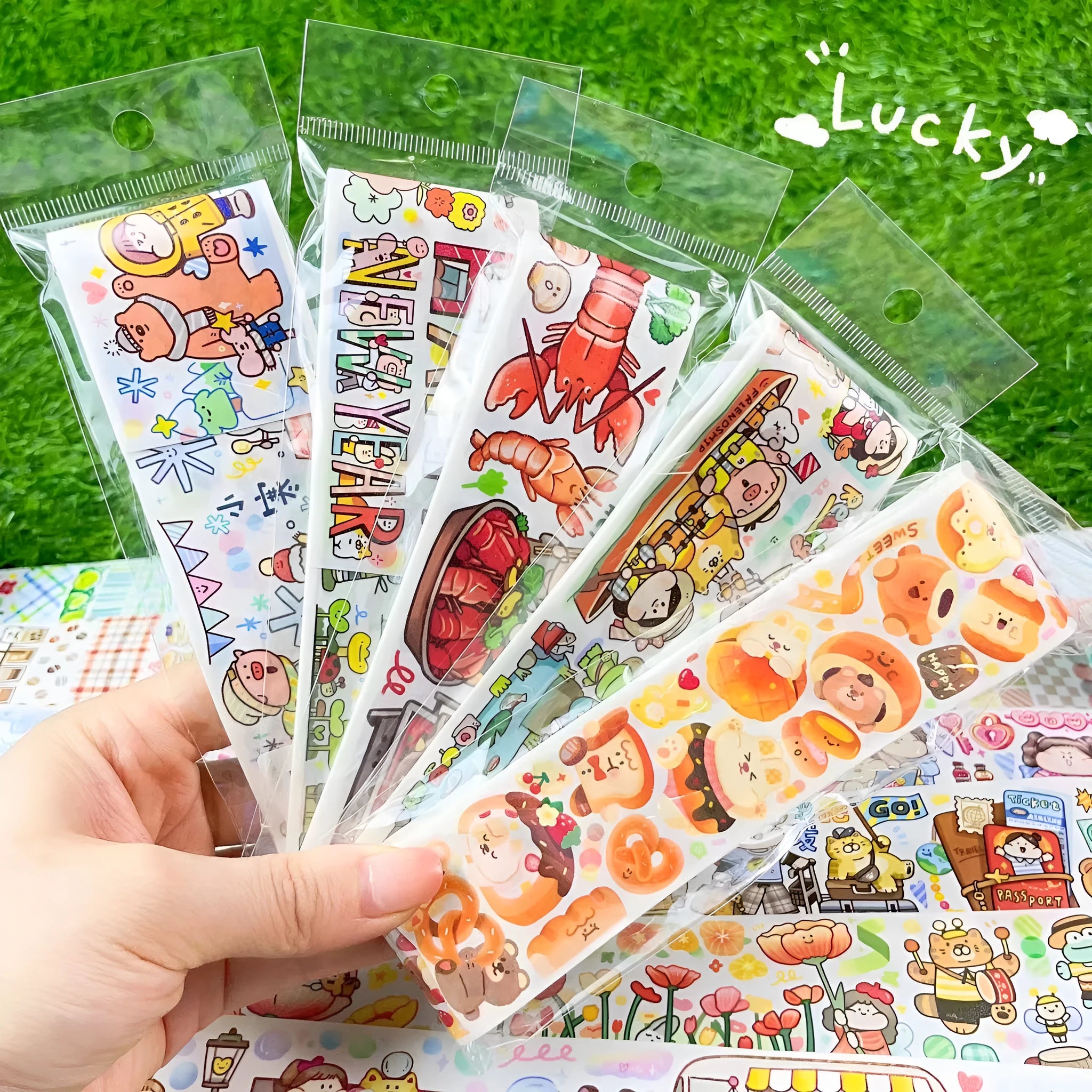 Sheet of colourful cartoon character stickers for haemorrhoid tape packaging on Japanese paper.