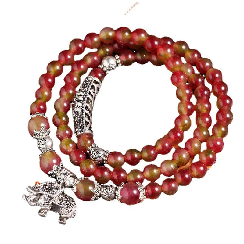 Handmade Chinese knot bracelet with natural watermelon crystal beads in traditional design