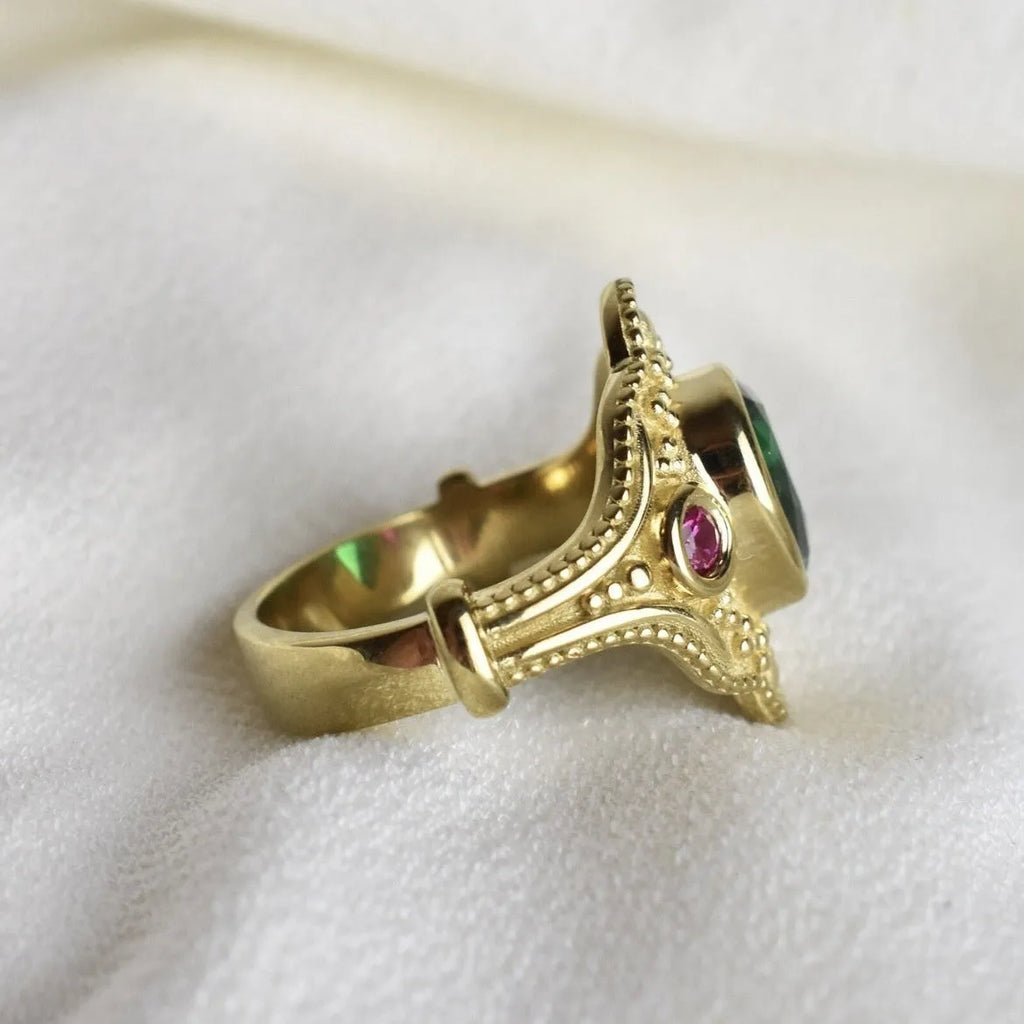Gold-plated women's ring with geometric design and golden lvzuan colour on a white background.
