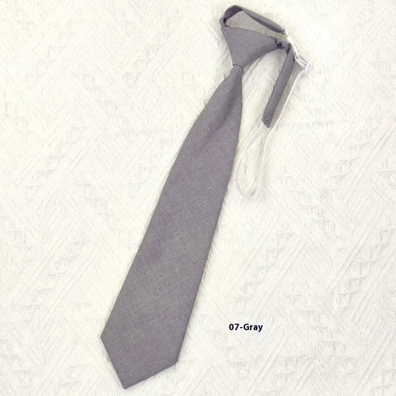 Men's solid colour cotton bow tie in navy blue with arrow-style tapered design
