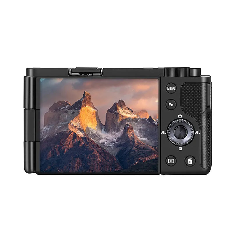 Optical digital micro single camera in black with ultra wide angle lens, touch screen, 117x84x66mm, sling attached, on travel background