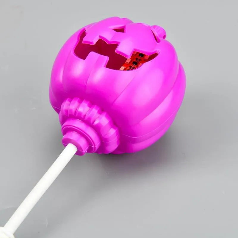 Plastic pumpkin-shaped decorative lamp with USB charging port, shown with purple or yellow light option.