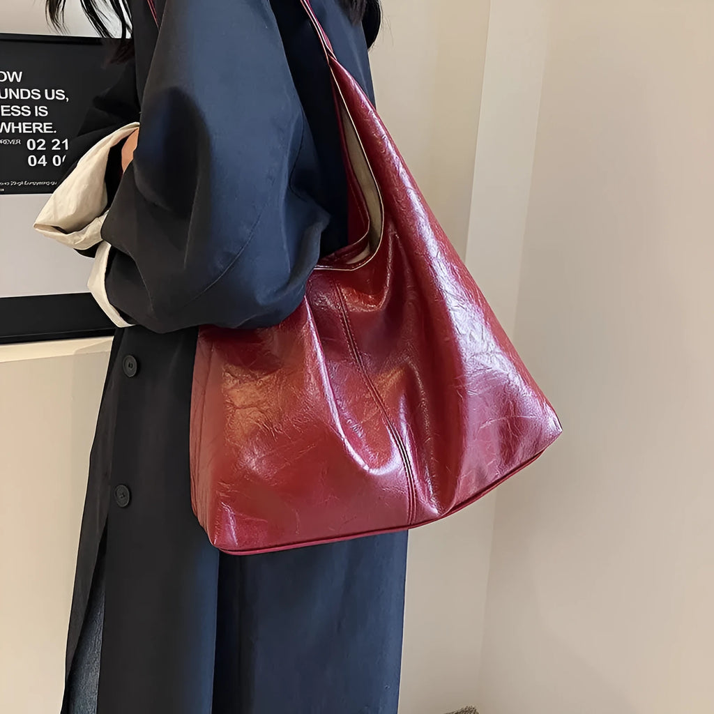 Casual soft PU leather shoulder bag in street trend style with large capacity and sandwich pocket.