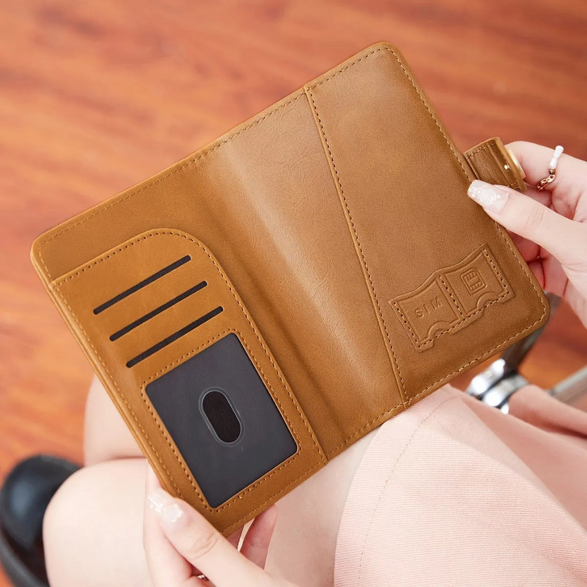PU leather passport holder with RFID protection in multiple colour options including pink, black, and blue