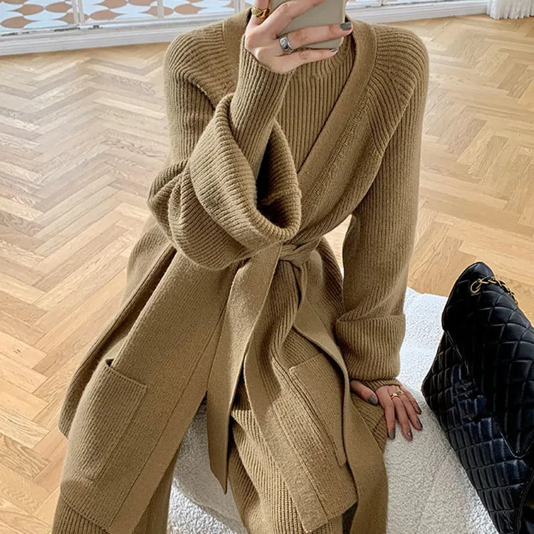 Women's apricot knitted three-piece set showing cardigan, top and wide-leg trousers with leather stitching