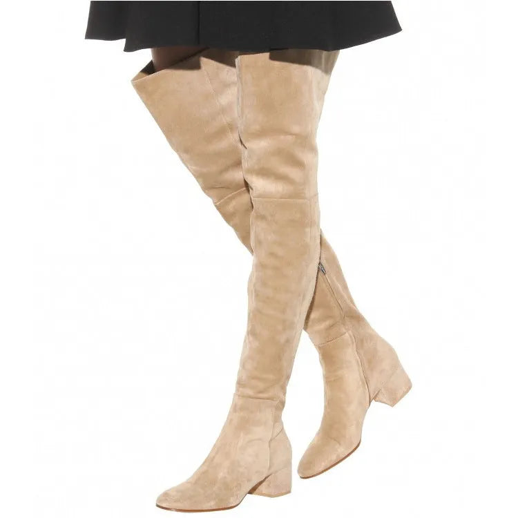 Grey women's suede flat over-the-knee boots with a pointed toe and low thick heel on a neutral background.