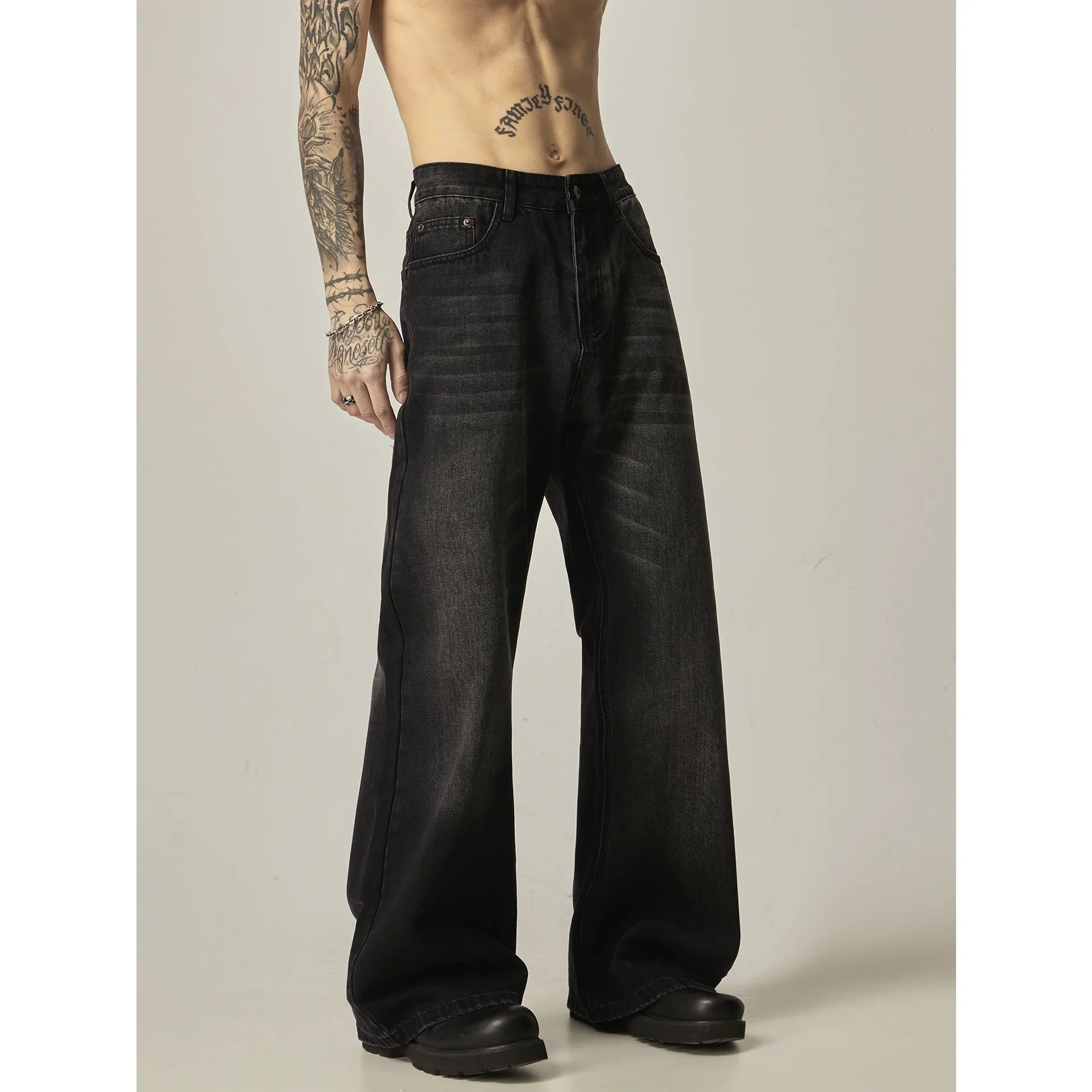 Black retro straight leg jeans with loose fit and zipper fly on hanger