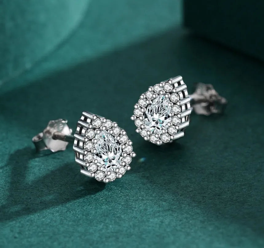 Women's silver water drop ear studs made from 925 sterling silver with diamond treatment