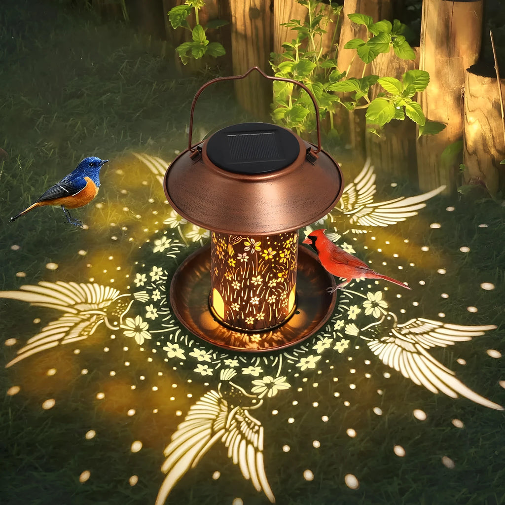 Solar powered bird feeder with hummingbird pattern and LED lights for outdoor garden decoration