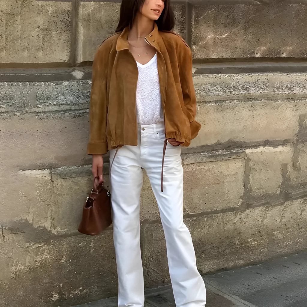 Retro-style loose-fit solid colour jacket with long sleeves on a hanger.