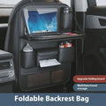 Black leather car seat back storage rack with handle, suspended on a car seat