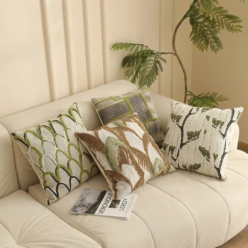Close-up of a retro floral jacquard cushion cover in a choice of colours, showing texture and zip detail.