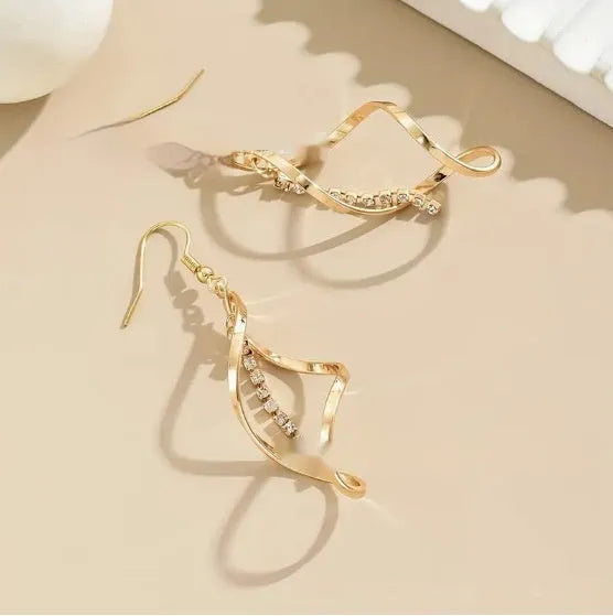 Gold geometric spiral design alloy earrings with elliptical shape