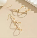 Gold geometric spiral design alloy earrings with elliptical shape