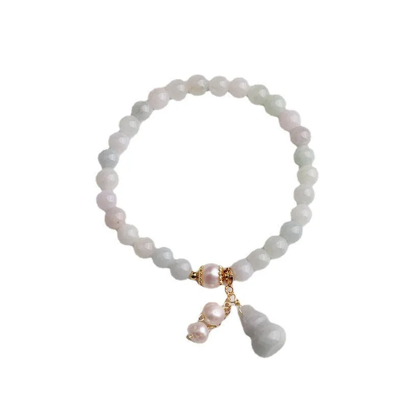 Chinese style jade bracelet with gourd design featuring natural emerald stone and pearl accents