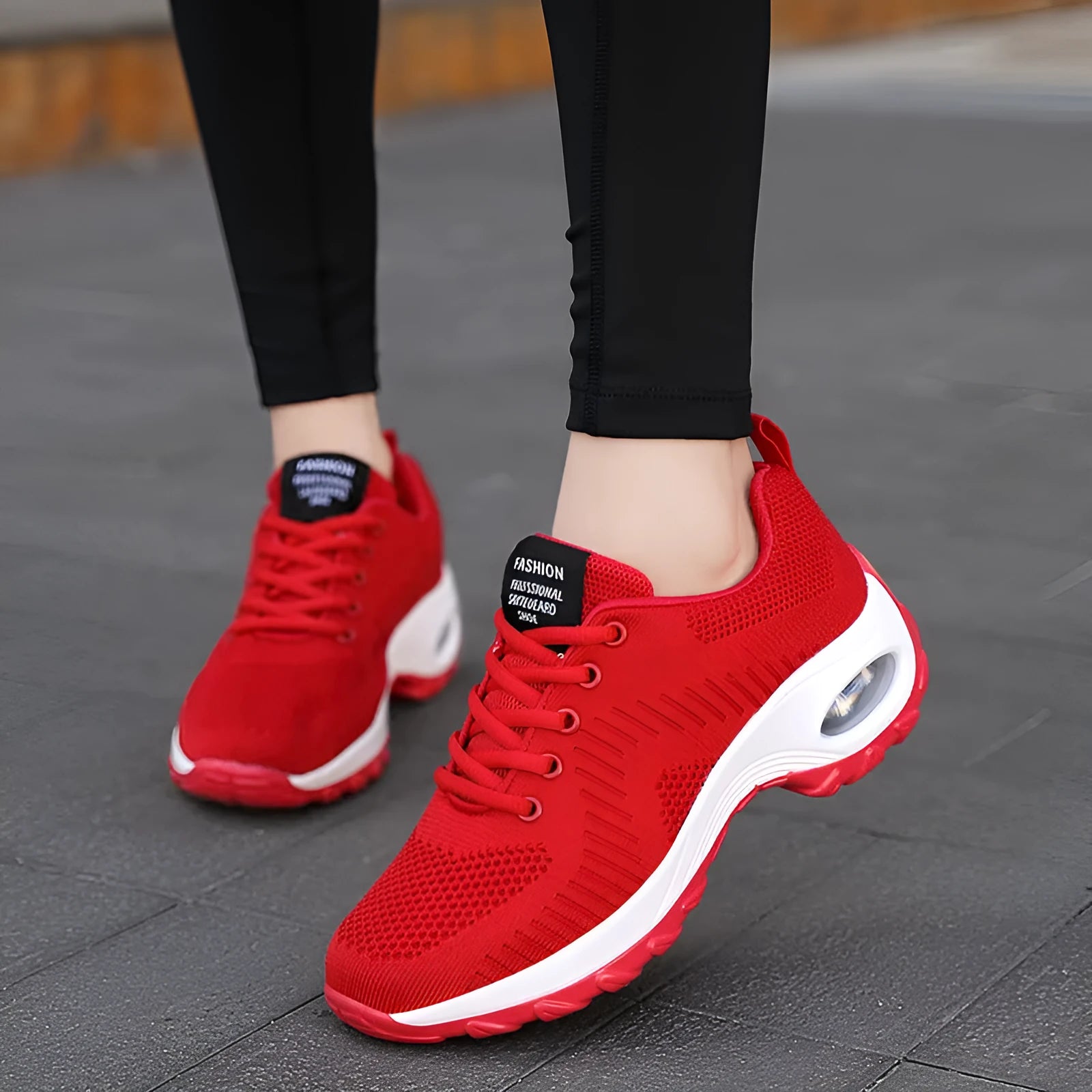 Women's red mesh sneakers with round toe and lace-up front, showing 3-5cm mid heel height