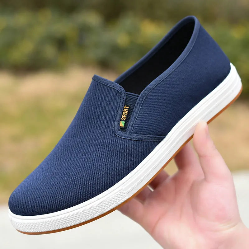 Men's black and blue canvas slip-on shoes with round toe and low-top design