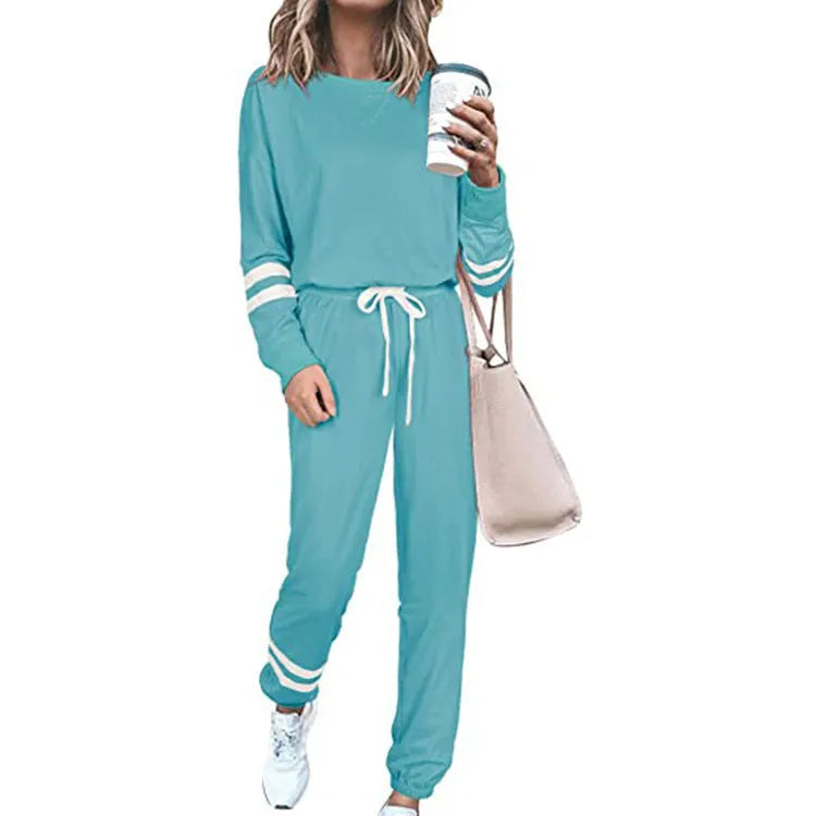Women's loose-fitting plus size casual suit in a solid colour, featuring a half-sleeve top and trousers.