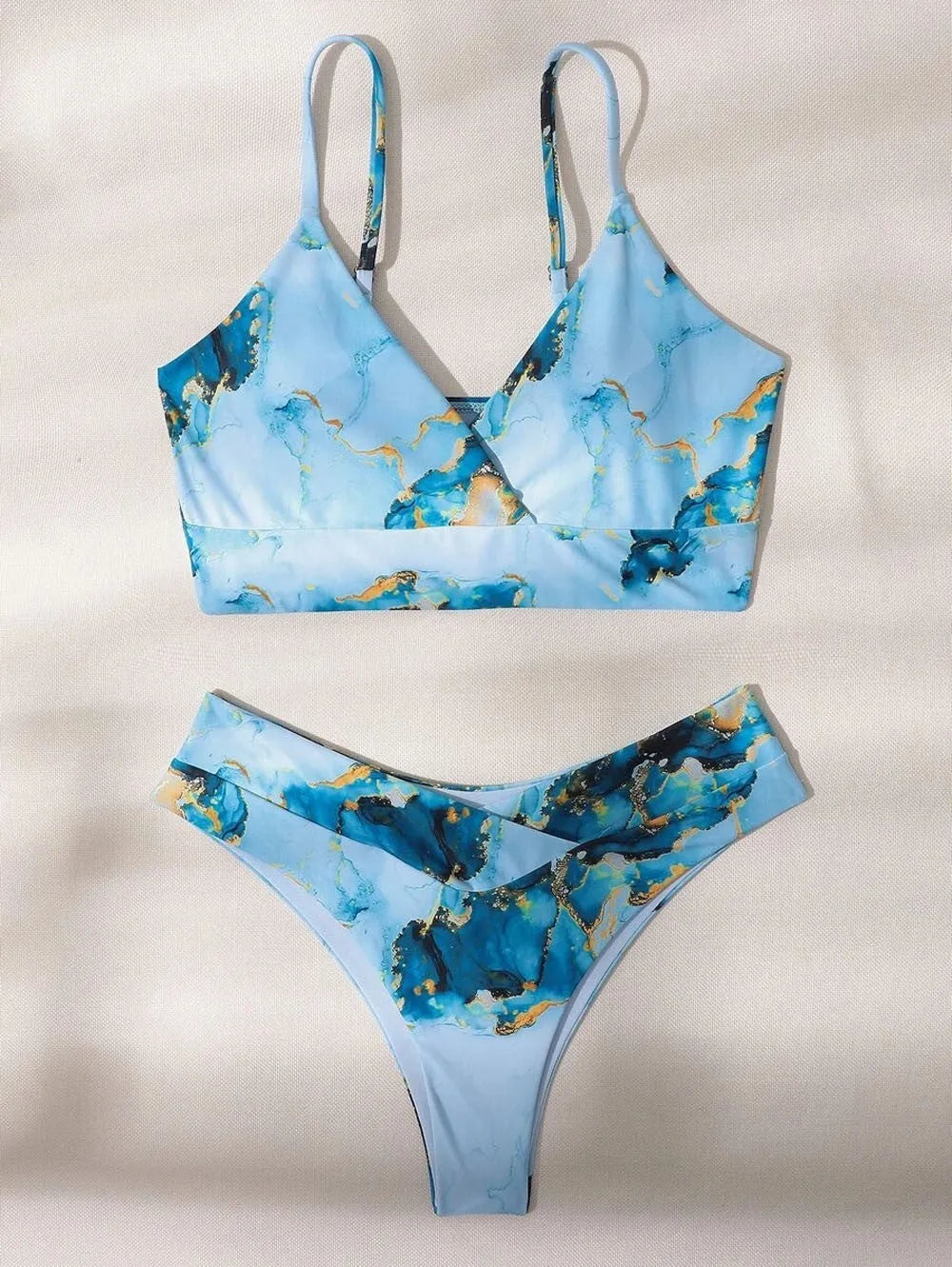 Women's marble tie-dye print high-waisted bikini set with U-neck top on a mannequin.