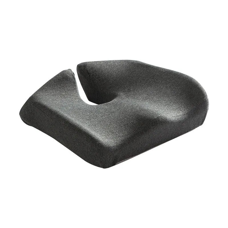 Memory foam office chair cushion with waist support in grey colour on wooden chair