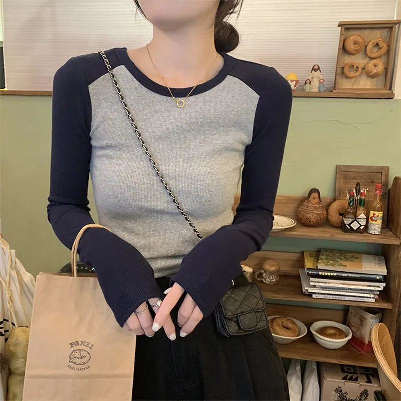 Women's slim fit viscose top with princess sleeves in short length showing embroidery detail