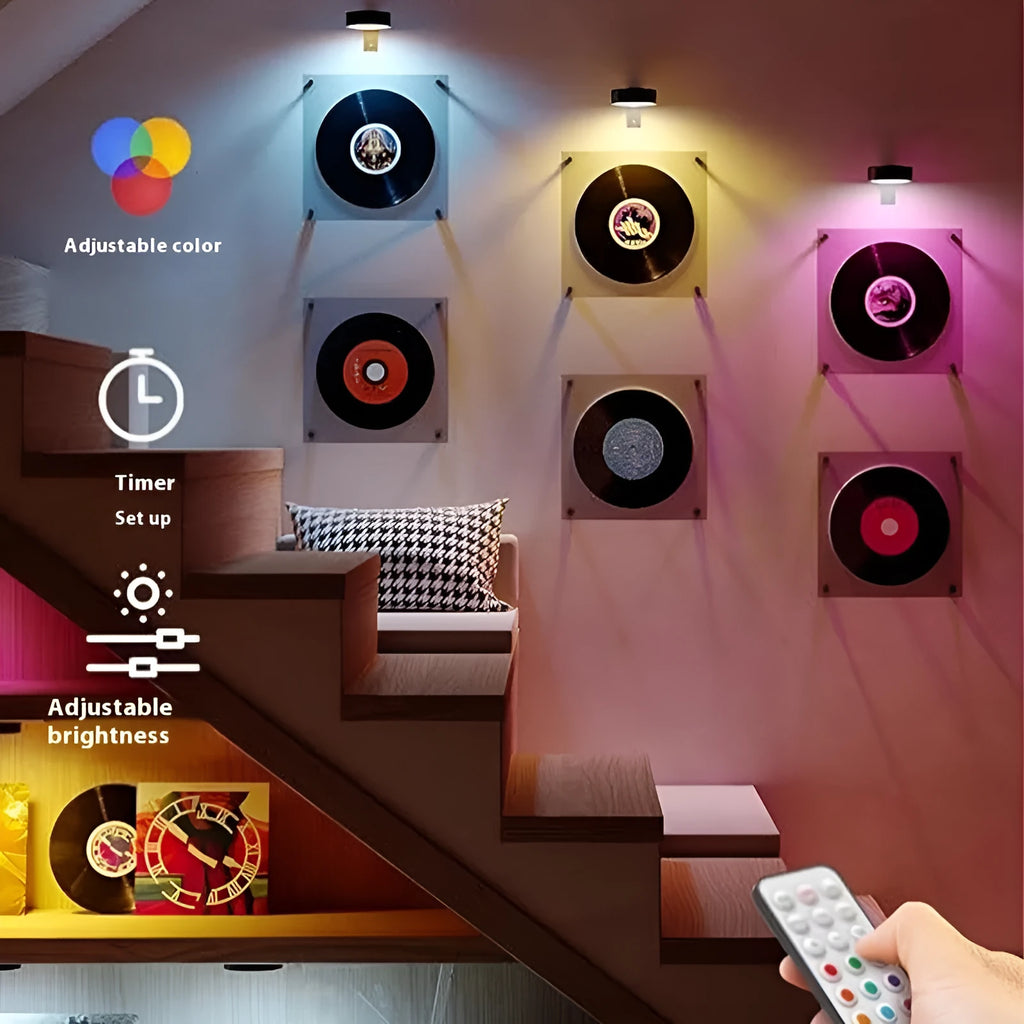 Wireless magnetic LED painting light in black, mounted on wall with remote control.