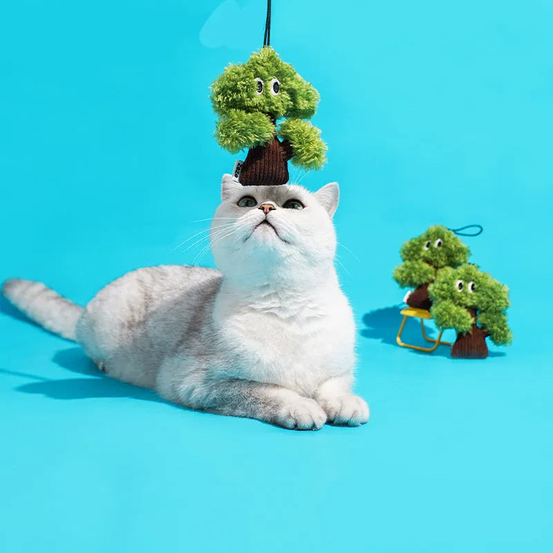 Pine tree-shaped cat mint toy bag pendant and a separate cat tease stick on a white background