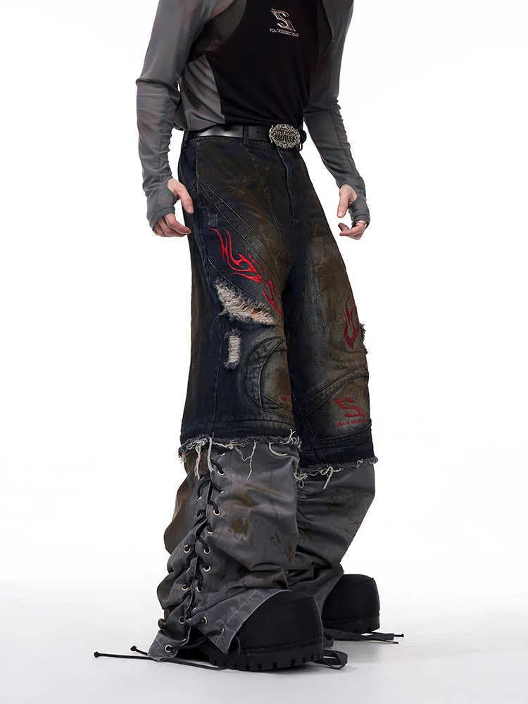 Men's retro-style denim jeans with detachable legs in a wide-leg, loose fit.