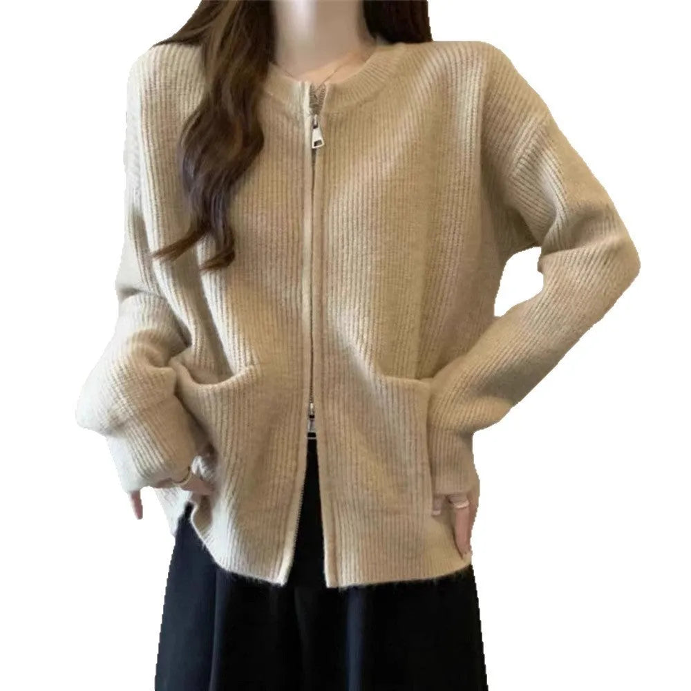 Beige viscose fibre long sleeve cardigan sweater coat laid flat, showing button front and soft texture.