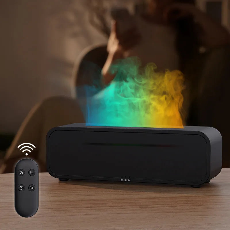Black and white aroma diffuser with remote control on a table, showing colour-changing LED lights.