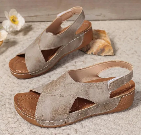 Women's brown platform sandals with a decorative skirt and Velcro strap fastening.