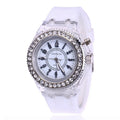 Women's LED luminous watch with round alloy case and colourful silicone strap.