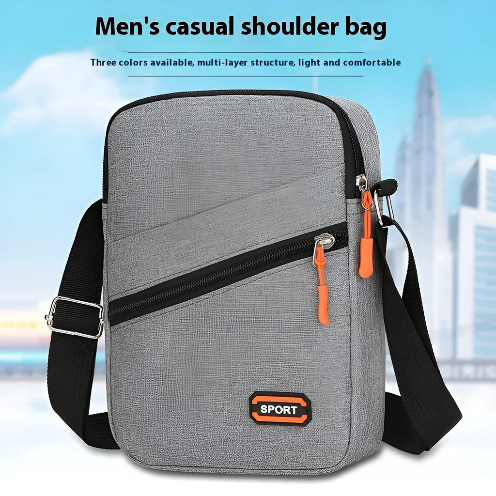 Oxford cloth crossbody commuter bag with contrast detailing in silver grey, black, or navy blue
