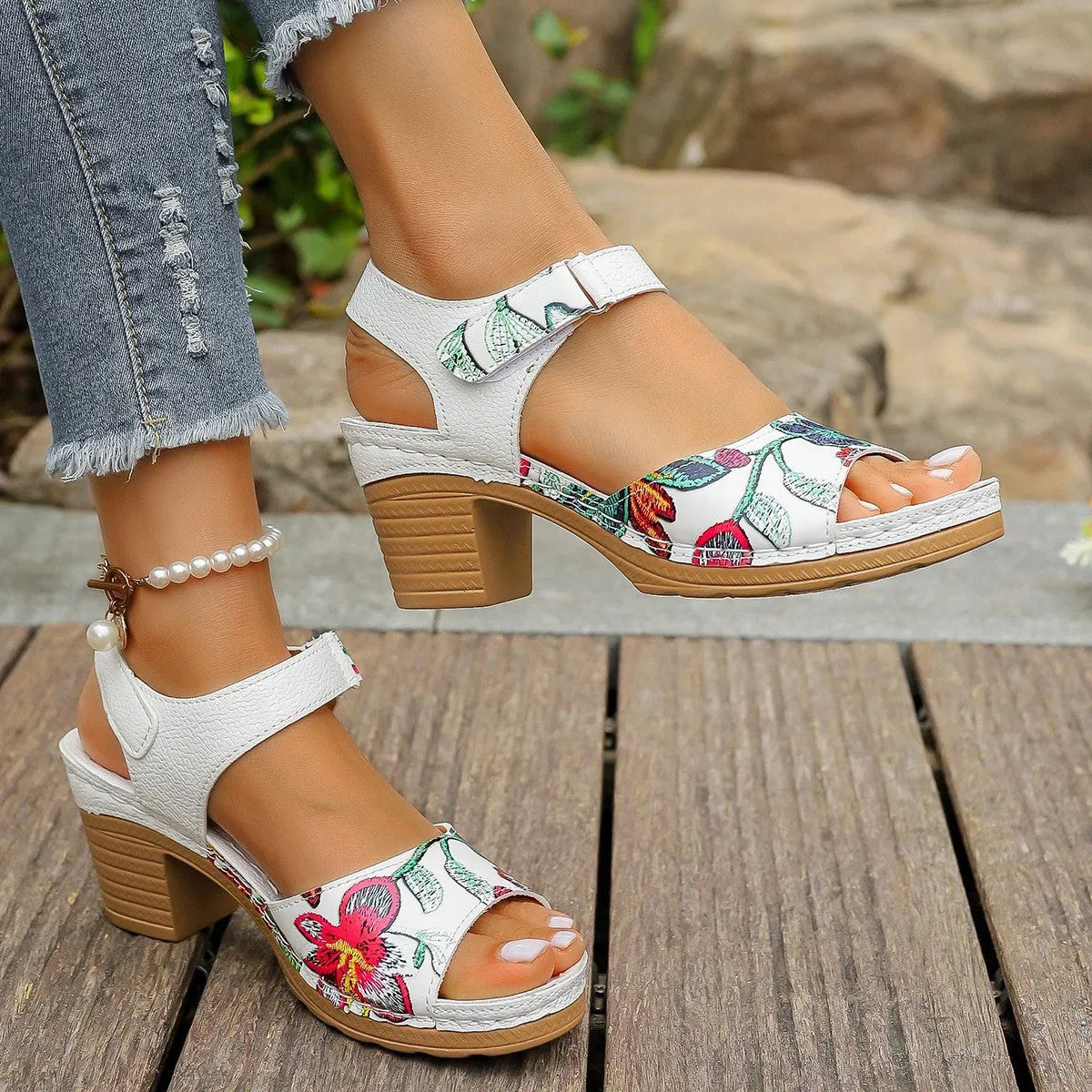 White women's high heel sandals with Velcro buckle fastening showing PU upper and rubber sole