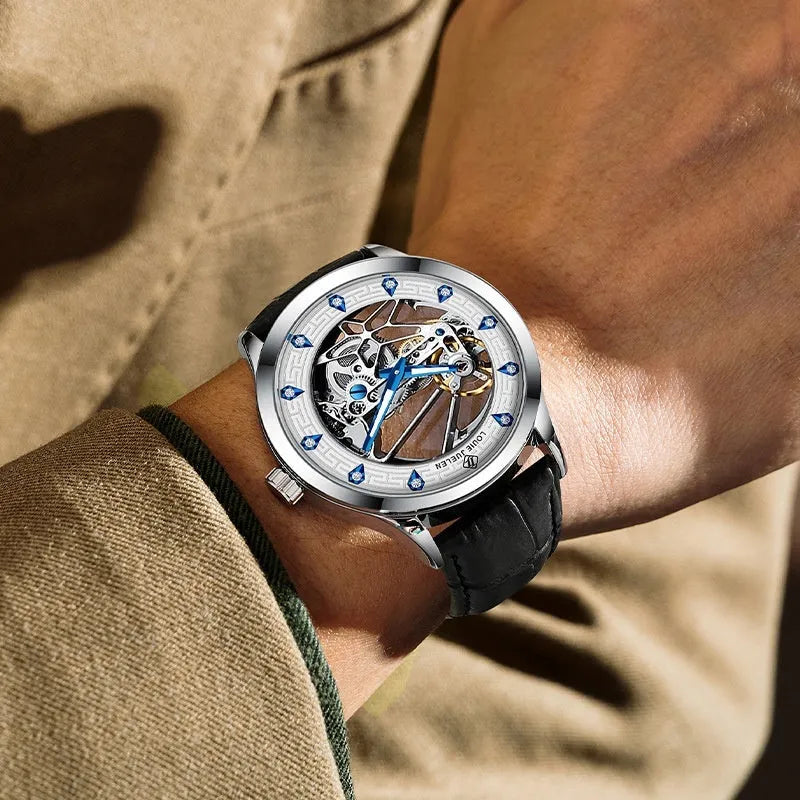 Men's silver mechanical watch with white dial, blue hands, black leather strap, and luminous markers