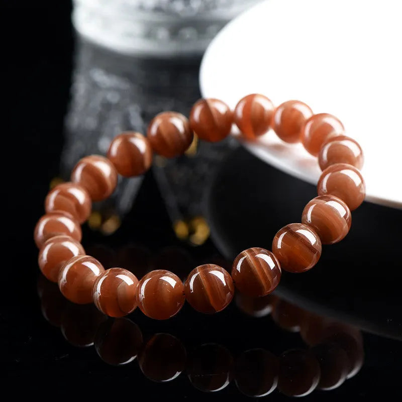 Natural old mine rhodochrosite round beads bracelet with Ruyi design element