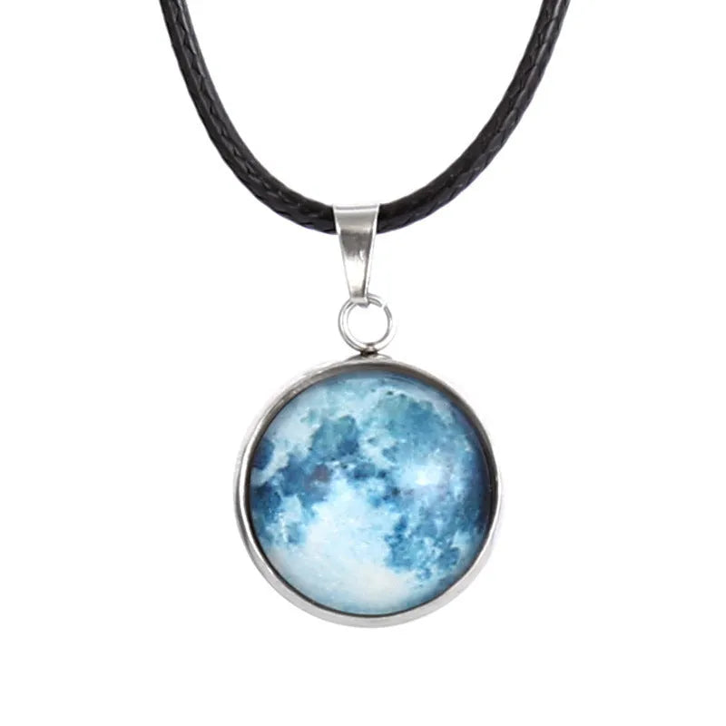 Luminous Christmas moon and night sky pendant necklace with adjustable chain on display
