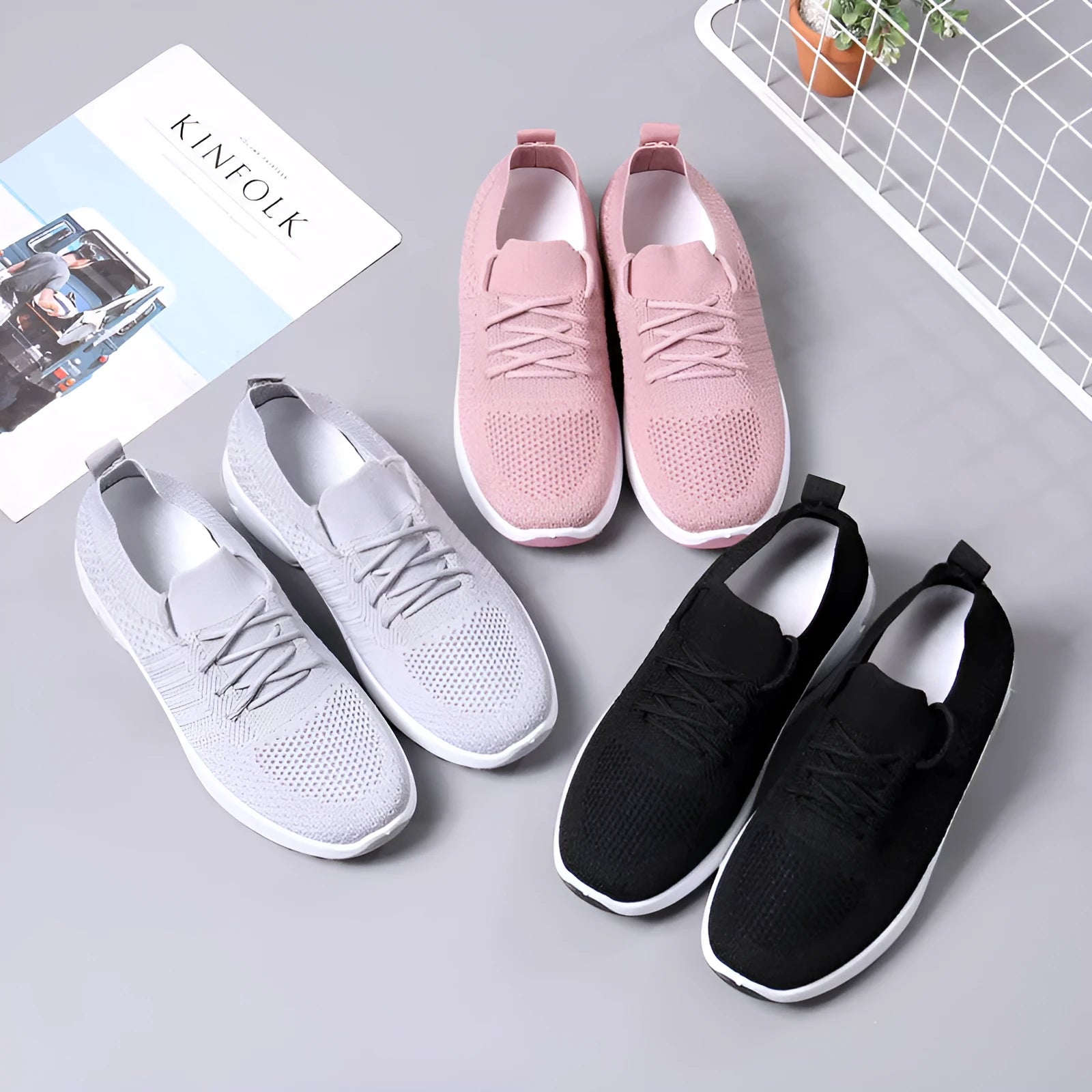 Women's solid colour casual sneaker with mesh upper, round toe, and front laces.