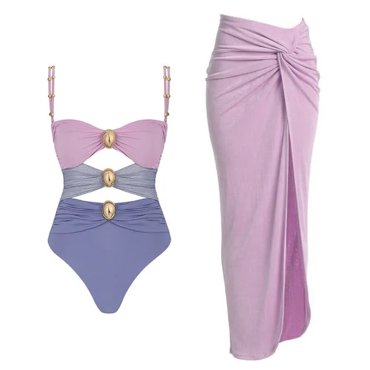 Women's solid colour one-piece swimsuit with matching skirt and gold button detail in assorted colours