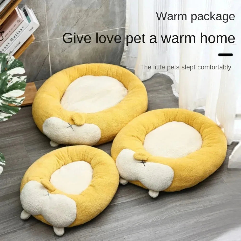 Corgi-shaped plush pet bed for dogs and cats in grey, shown in a home setting.