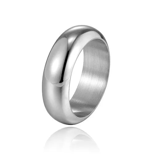 A glossy electroplated titanium steel ring shown in gold, black, and steel colour options on a plain background.
