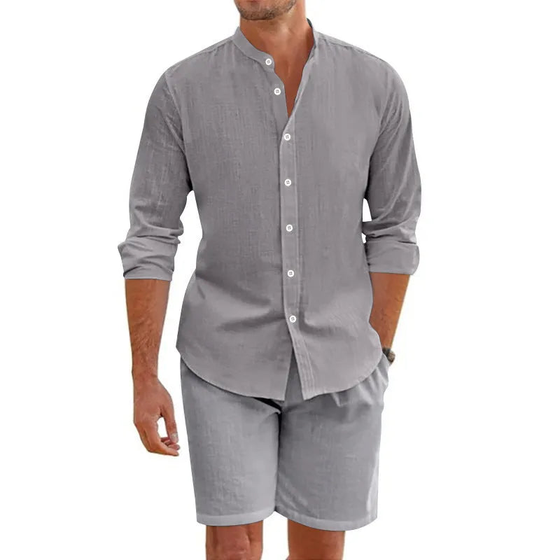 Men's dark grey linen-blend summer suit with short-sleeve lapel shirt and drawstring shorts on a hanger