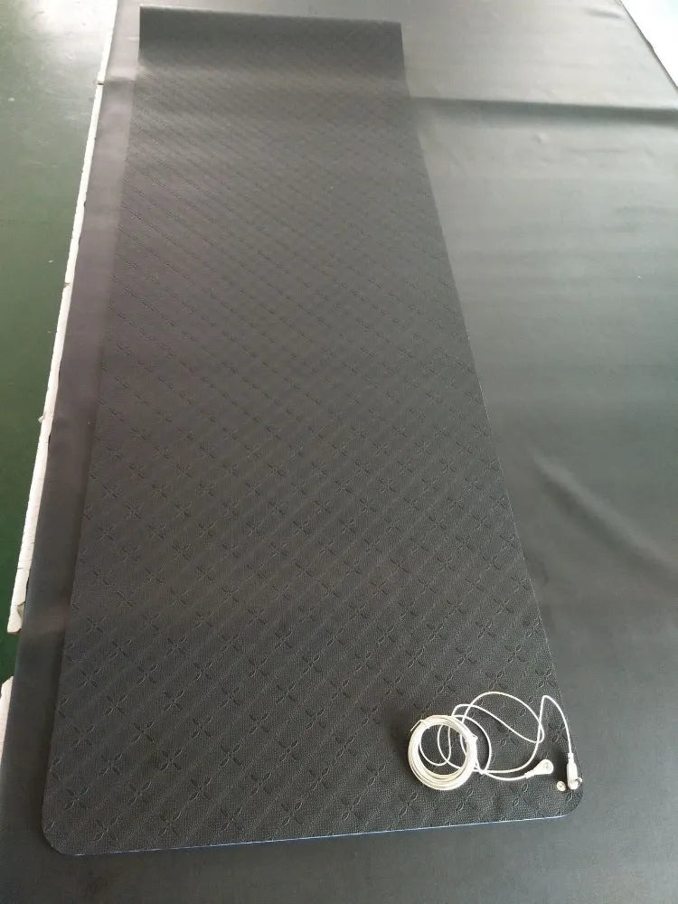 Blue conductive yoga mat with plant pattern and grounding wire, dimensions 182cm by 61cm.