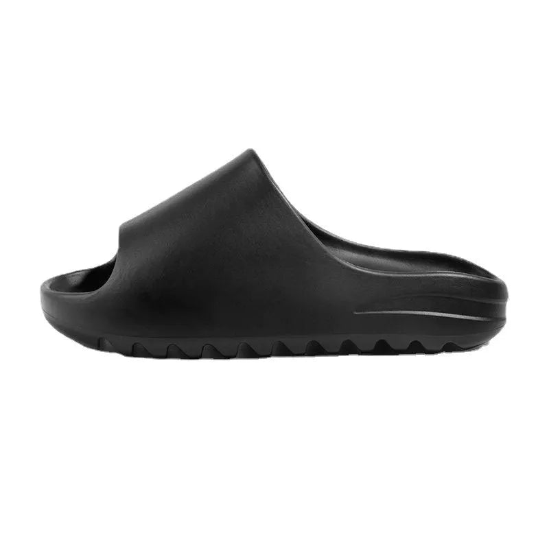 Women's thick-sole beach slippers in beige, shown on a sandy background.