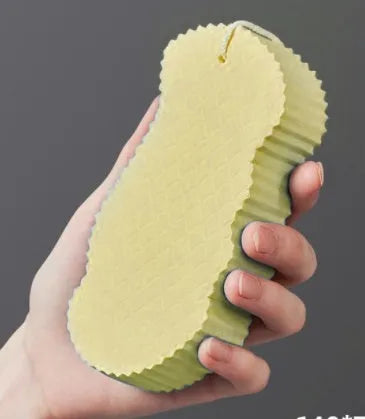 3D white bath sponge with fish scale pattern for gentle body exfoliation.