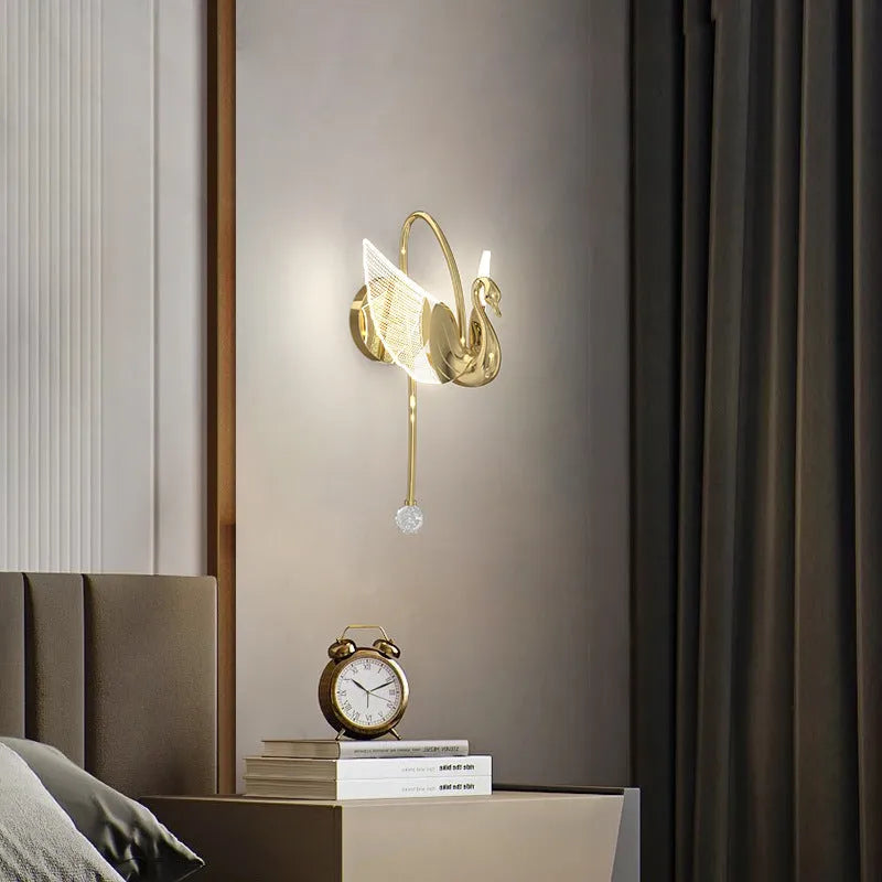 Gold swan-shaped LED wall lamp with acrylic shade for modern bedroom bedside lighting