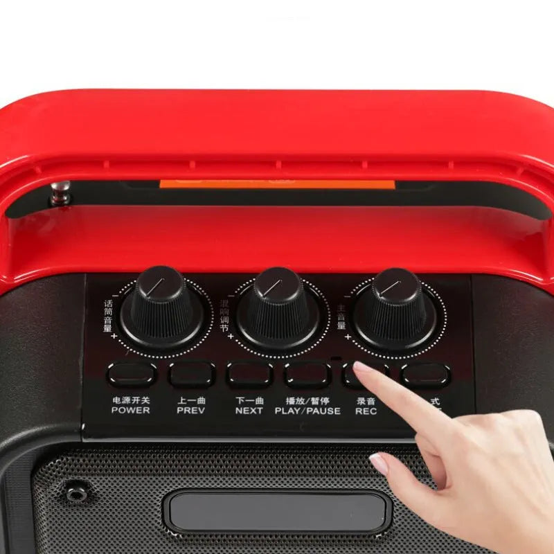 MS62AI portable Bluetooth speaker with wireless microphone, remote control, and charging cable.