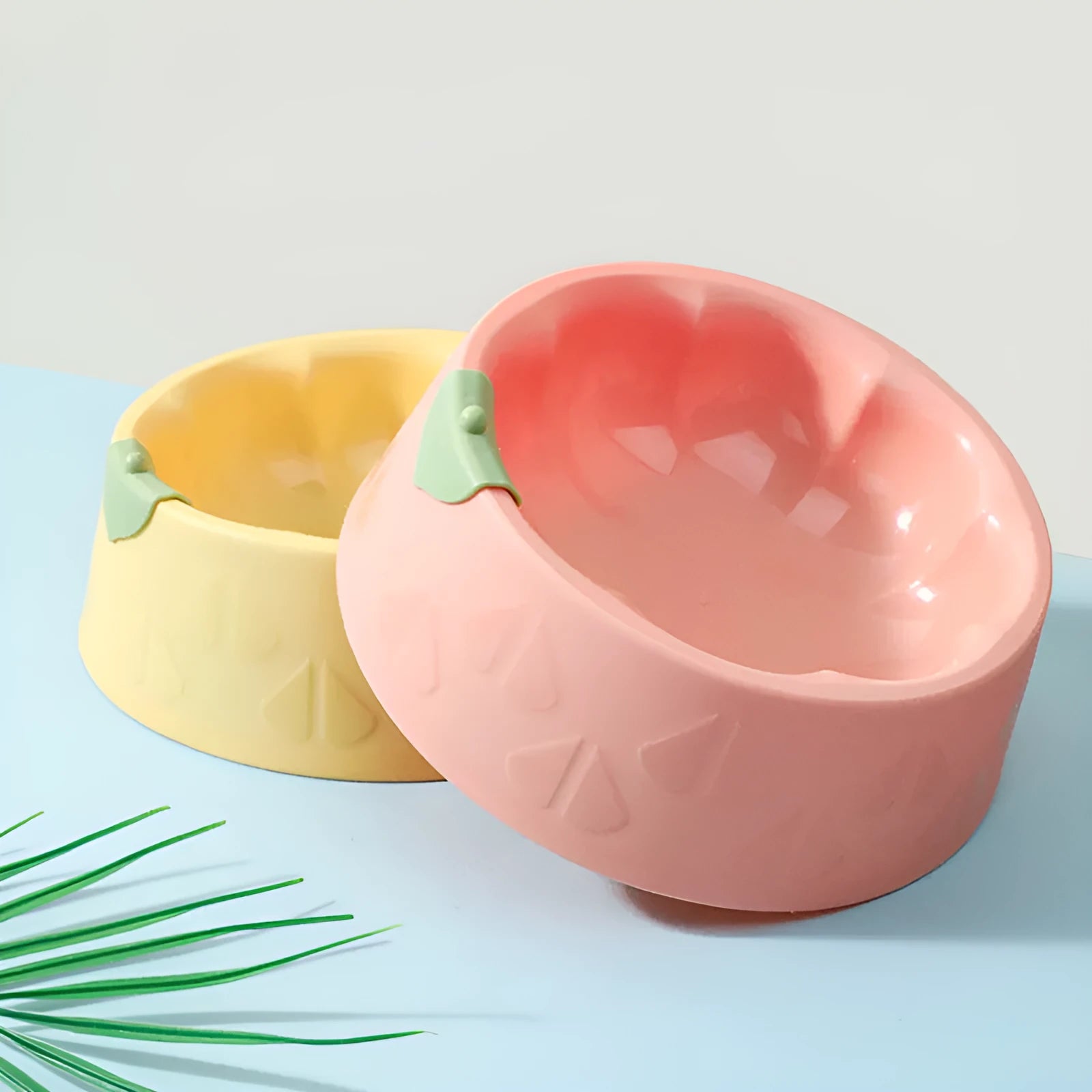Green plastic double pet bowl with anti-tipping design for dog and cat food and water
