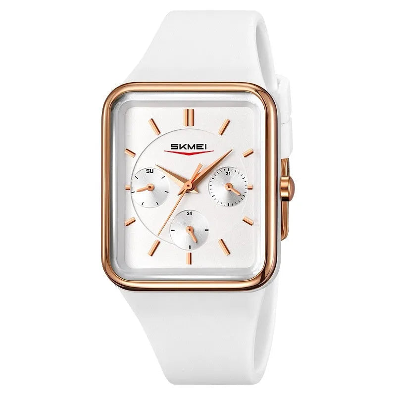 Square analogue silicone watch for women in white rose gold colour on a wrist, showing slim profile.