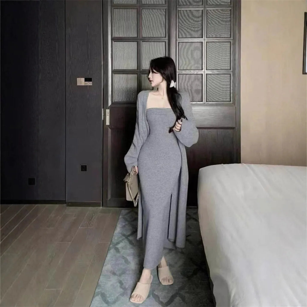 Women's grey knitted dress and matching coat suit with flocked pattern, long skirt, and regular sleeves.